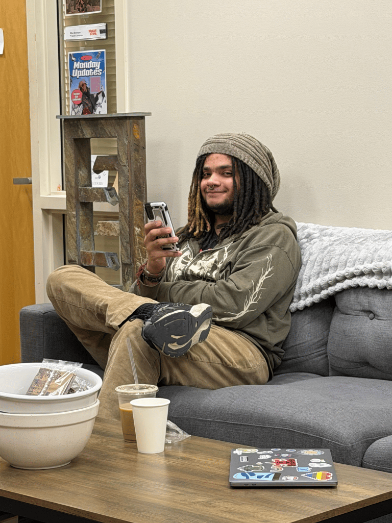 Photo of StepUP scholar sitting in the StepUP office and smiling. 