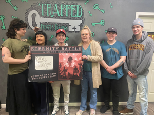 Six StepUP scholars posing with a puzzle room completion award