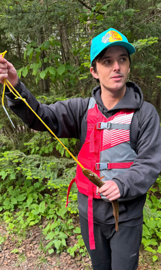 StepUP student holding a fishing pole