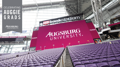 Zoom background with banner "Celebrating Auggie Grads Augsburg University" with photo of US Bank Stadium set up for graduation