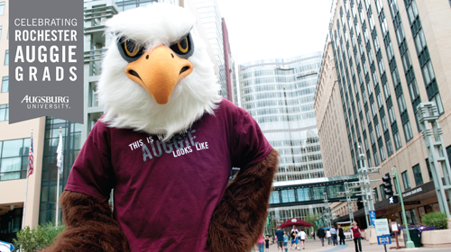 Zoom background with banner "Celebrating Rochester Auggie Grads Augsburg University" with Auggie Eagle