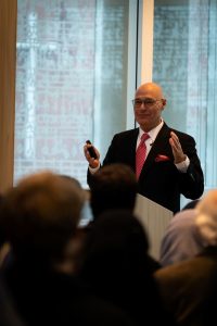 Photo of Fuad speaking to a group of Augsburg students in October, 2019.