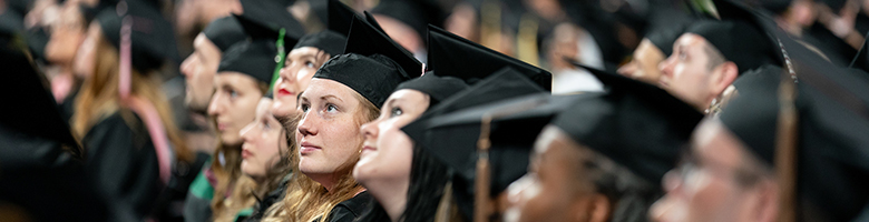 Augsburg graduates awaiting their name to be called for commencement.