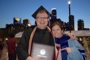 A photo of Gabe and Lindsay Starck at graduation.
