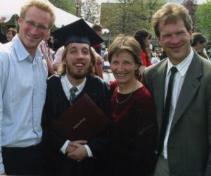 A portrait of Mike and Karl Helgeson with Erik and his brother, Paul at Erik's graduation.
