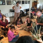 group weaves baskets