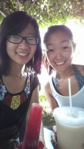 two young women enjoy malts