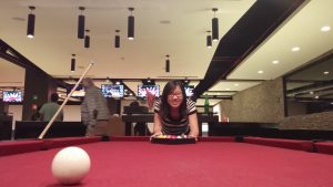 Student at a pool table