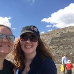 Students pose in front of pyramids in Mexico