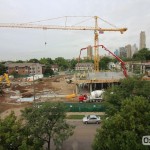 Construction crews completing the concrete pour for the second-story slab on the north wing of the Hagfors Center