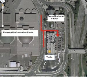 satellite map view of central lutheran church parking lot. red arrows indicate directions