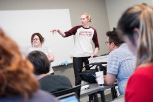 Classroom listening to two students speaking