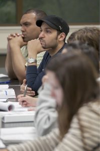 Students listening and taking notes