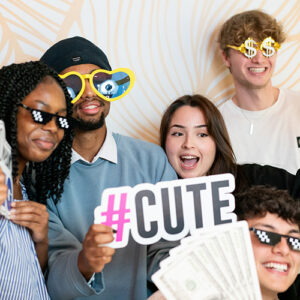 Five young adults smiling.