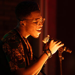 Image of young man singing.