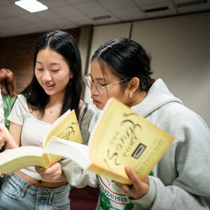 Two students reading books.