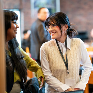 Various people networking in a room.