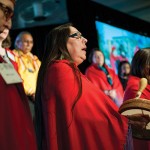 An ensemble of Native American women sings on International Women’s Day to honor and raise awareness of those Native American women who are victims of violence.