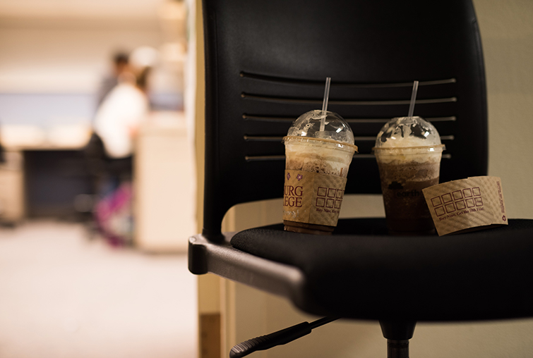 Coffee drinks sit outside lab space on chair