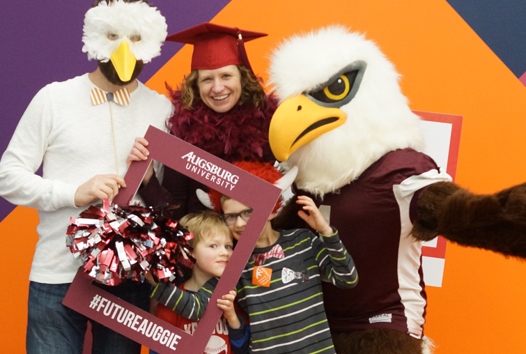 Family takes a funny photo at an alumni event