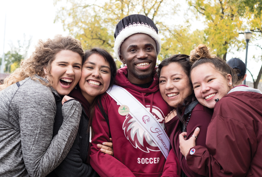 Students gather in the park for the Taste of Augsburg