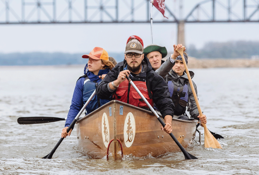 Students canoe down the Mississippi River