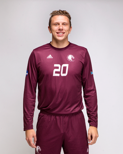 Daniel Hedstrom shows off the new soccer jerseys