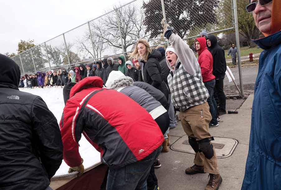 Augsburg community members helping to assemble the dome