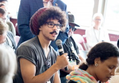 A student asking a question at a breakout session