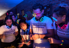 Students wearing glow stick sunglasses