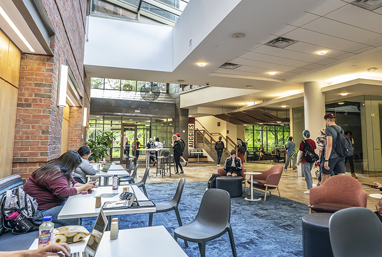 students seated in a lobby