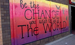 "Be the change you wish to see in the world" quote mural