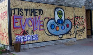 "It's time to evolve as a species" mural 