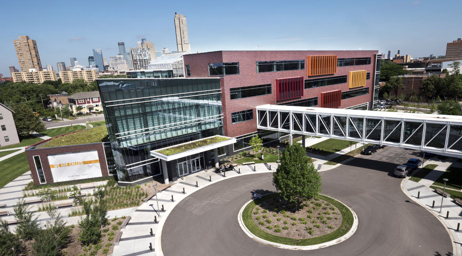 Hagfors Center on a spring day with the Minneapolis skyline behind it.