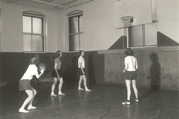 Auggies shoot hoops in Old Main gymnasium, circa 1945.