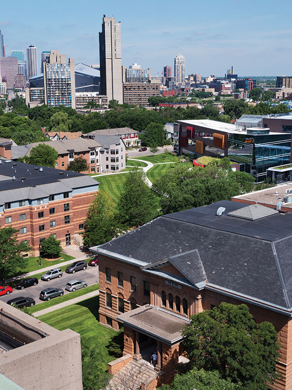 Augsburg University's campus in 2018. Old Main with the Minneapolis skyline in the background.