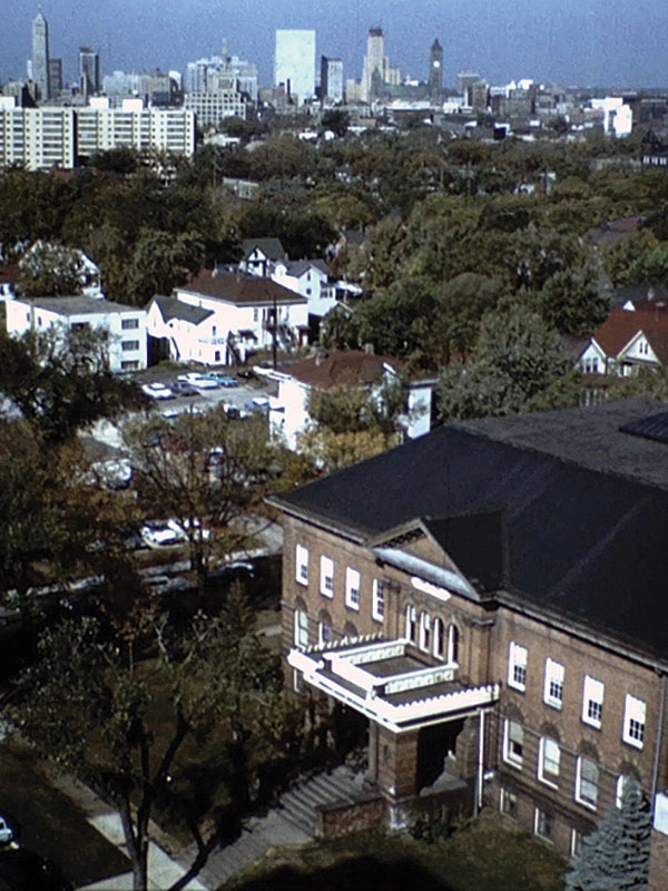 Augsburg University's campus in 1967. Old Main with the Minneapolis skyline in the background.