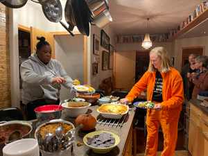 Augsburg travelers dishing up their meal