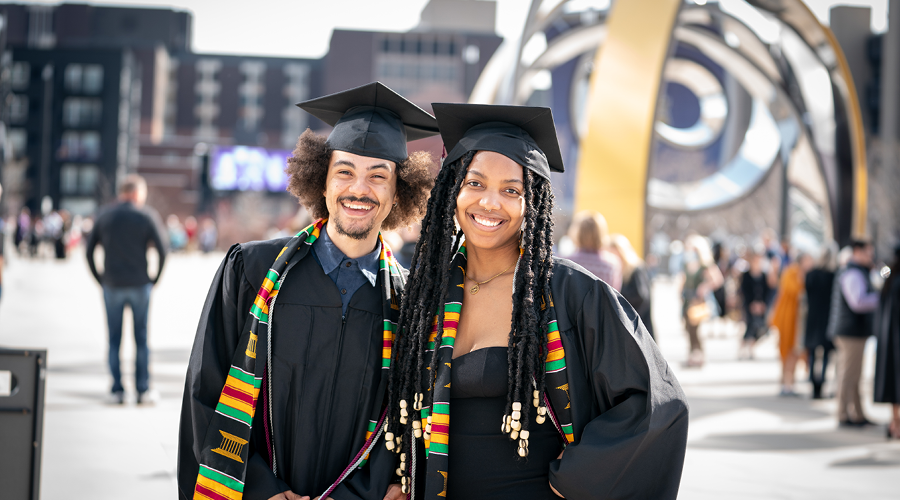 Augsburg students outside U.S. Bank Stadium after Commencement (Photo by Courtney Perry)