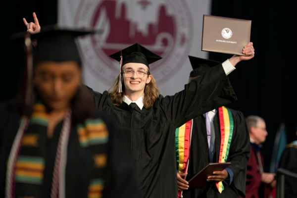 Student celebrating graduating