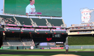 The Minnesota Twins recognized the Augsburg University men’s wrestling team by inviting Head Coach Tony Valek to throw the ceremonial first pitch on June 20. (Photo by Don Stoner)