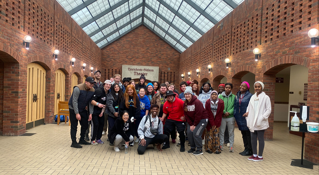 Students involved in the 2023 Campus Ministry trip to New Orleans gather in the Foss Center atrium.