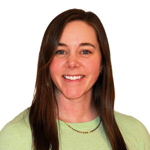 Headshot of kelsey reif in front of a white background. She is wearing a light green shirt and has hair past her shoulders