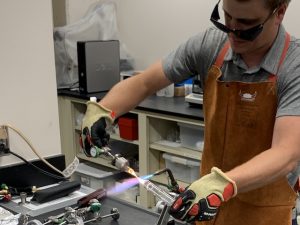 Jeff Walter sealing a tube