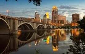 A night photo of a bridge over the Mississippi River.