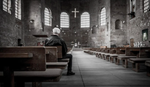 person alone in church