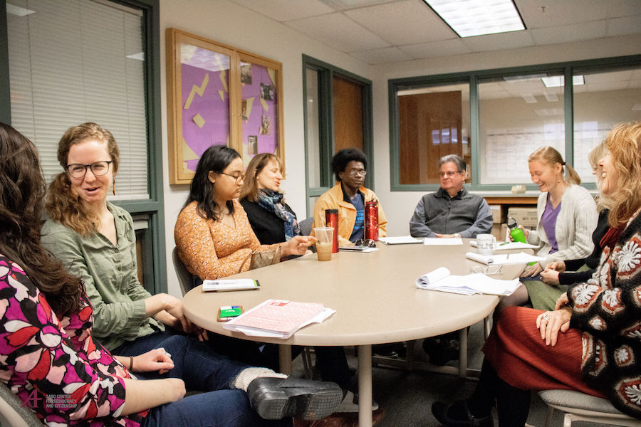 Sabo Center staff conversing around a table