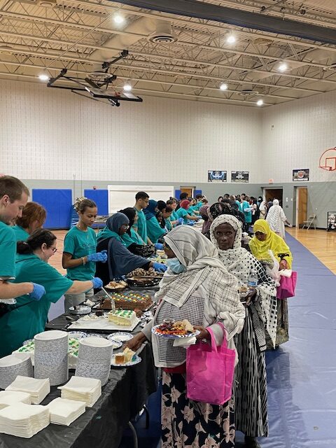 Volunteers serving dinner for the Annual Cedar Riverside Multicultural Dinner