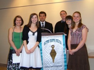 Students inducted into AKD pose for a photo.