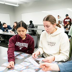 Two female students working together at a desk
